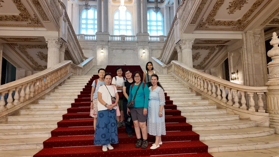 Our travellers on the grand staircase of the Palace of the Parliament, Bucharest
